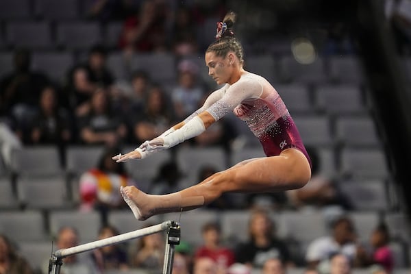 Oklahoma's Jordan Bowers competes on the uneven bars during the NCAA women's gymnastics championships in Fort Worth, Texas, Thursday, April 17, 2025. (AP Photo/Tony Gutierrez)