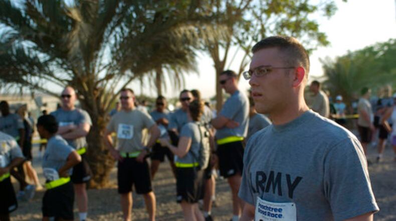 Running a "shadow" version of the Peachtree Road Race outside of Atlanta has long been a part of the event. In 2008, these U.S. Army service members prepare to run a "shadow" version of the race at Camp Victory in Baghdad, Iraq. (Courtesy of Staff Sgt. Michel Sauret/U.S. Army)