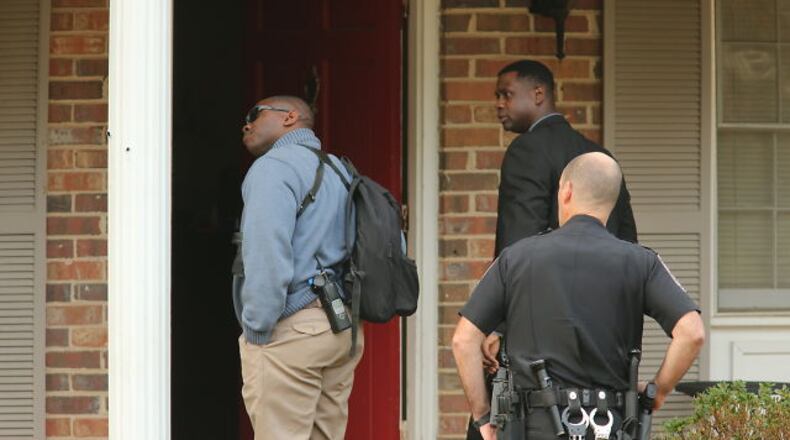 DeKalb police investigate a shooting inside a home near Ellenwood. JOHN SPINK / JSPINK@AJC.COM