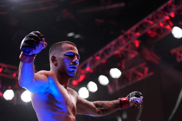 Alexandre Pantoja celebrates after defeating Kai Kara-France in a flyweight title fight at UFC 317, Saturday, June 28, 2025, in Las Vegas. (AP Photo/John Locher)