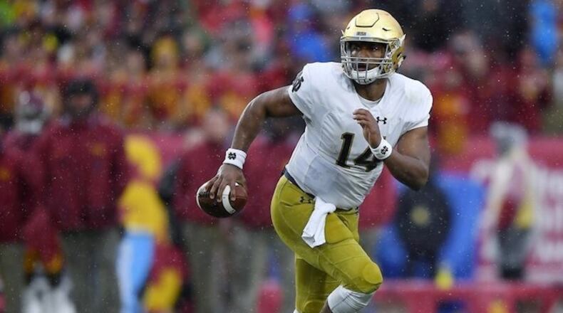 In this Nov. 26, 2016, file photo, Notre Dame quarterback DeShone Kizer runs the ball during the team's NCAA college football game against Southern California in Los Angeles. MARK J. TERRILL/AP Photo