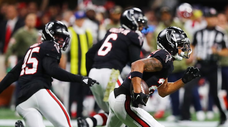 111821 Atlanta: Falcons cornerback A.J. Terrell intercepts Patriots quarterback Mac Jones during the third quarter in a NFL football game on Thursday, Nov. 18, 2021, in Atlanta.    “Curtis Compton / Curtis.Compton@ajc.com”