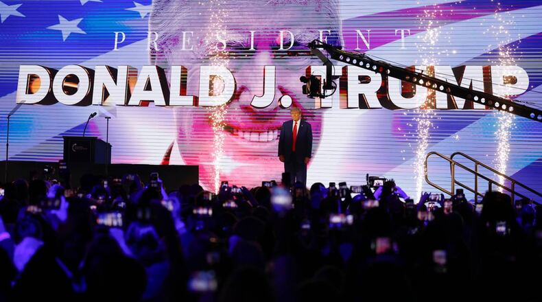 Donald Trump arrives on stage at the Turning Point Action Conference at the Palm Beach County Convention Center in West Palm Beach, Florida, on Saturday, July 15, 2023. (Al Diaz/Miami Herald/TNS)