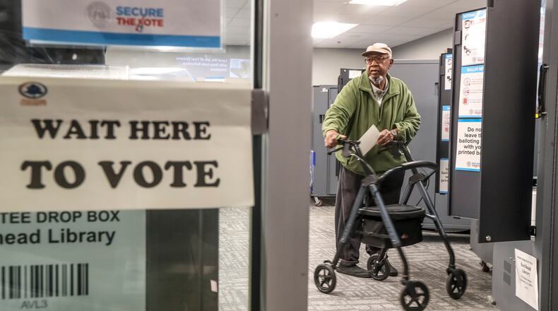 A new Atlanta Journal-Constitution survey offers insights into how Georgia voters plan to cast their ballots in November. (John Spink / AJC file photo)