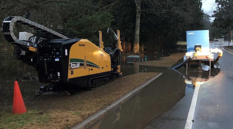 Columns Drive remains closed from Willow Knoll Drive to Atlanta Country Club Drive due to flooding after new-year rains have soaked Cobb County.
