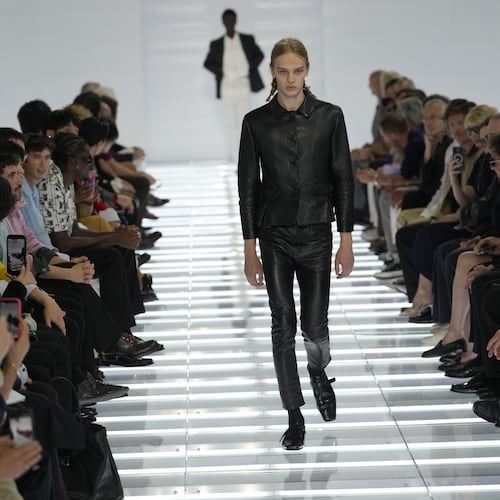 A model wears a creation from Prada's Spring/Summer 2027 men's collection presented in Milan, Italy, Sunday, June 21, 2026. (AP Photo/Luca Bruno)