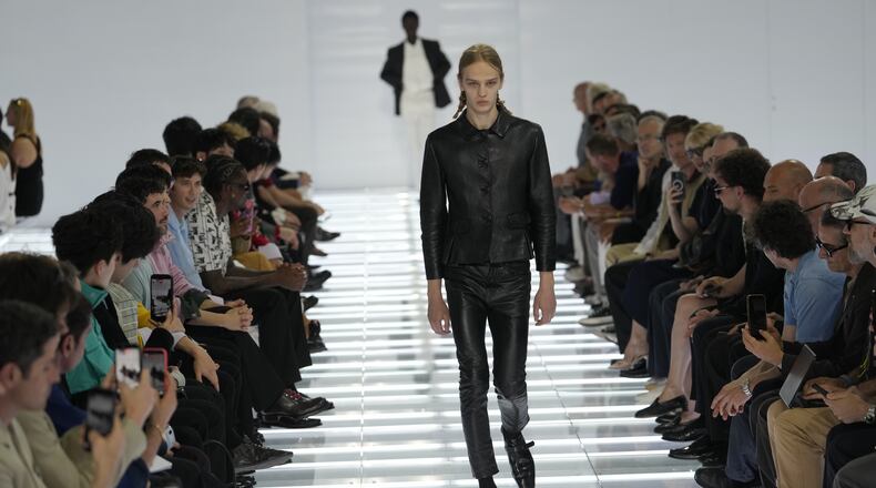A model wears a creation from Prada's Spring/Summer 2027 men's collection presented in Milan, Italy, Sunday, June 21, 2026. (AP Photo/Luca Bruno)