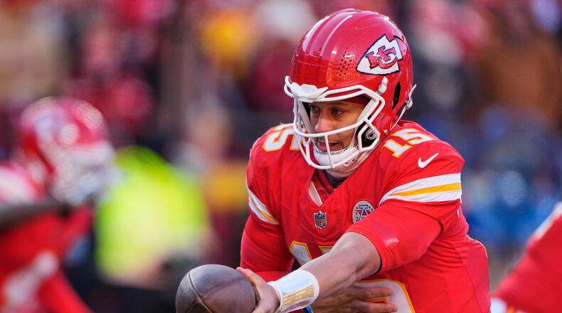 FILE - Kansas City Chiefs quarterback Patrick Mahomes hands off the ball during the second half of an NFL football game against the Los Angeles Chargers, Dec. 14, 2025, in Kansas City, Mo. (AP Photo/Charlie Riedel, File)