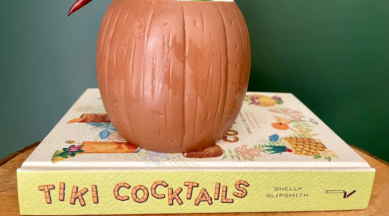 This is a firecracker cocktail that includes watermelon and rum, with a little chile kick. It's based on a recipe in a new book about tiki cocktails by Shelly Slipsmith. (Angela Hansberger for The Atlanta Journal-Constitution)
