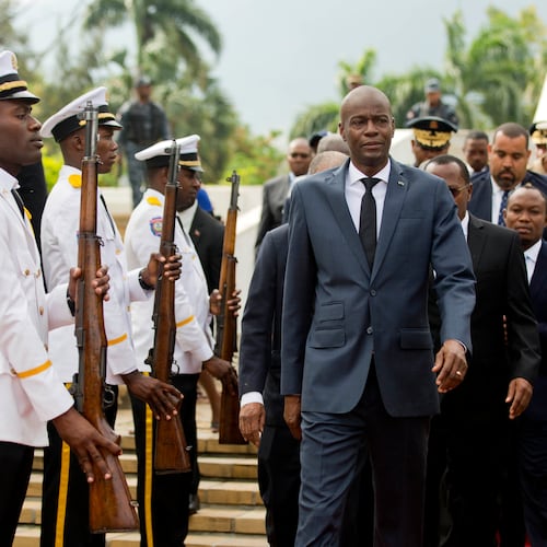 FILE - Haiti's President Jovenel Moise, center, leaves the museum during a ceremony marking the 215th anniversary of revolutionary hero Toussaint Louverture's death, at the National Pantheon museum in Port-au-Prince, Haiti, April 7, 2018. (AP Photo/Dieu Nalio Chery, File)