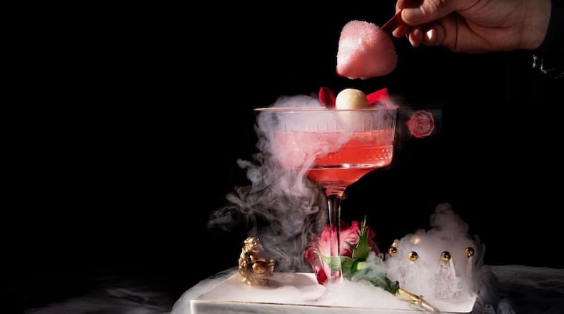 Steak Market Atlanta's lychee rose martini is both a delicious cocktail and performance art. Courtesy of Steak Market Atlanta
