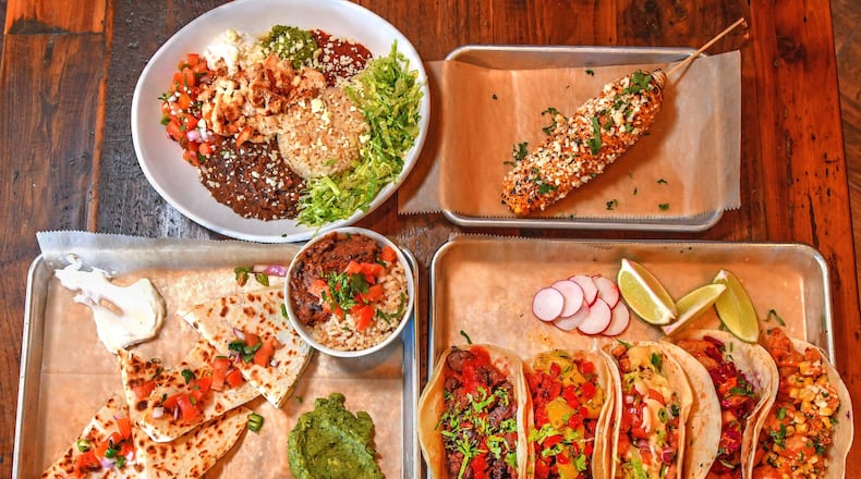 From top left: Cantina Bowl, Grilled Street Corn, Quesadillas (bottom left) Carne Asada, Al Pastor, Grilled Chicken, Fried Catfish and Fried Shrimp Tacos. CONTRIBUTED BY CHRIS HUNT PHOTOGRAPHY