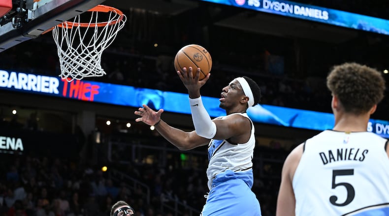 Onyeka Okongwu (17) goes to the basket for a shot during the first half in an NBA basketball game at State Farm Arena, Friday, February 28, 2025, in Atlanta. (Hyosub Shin / AJC)
