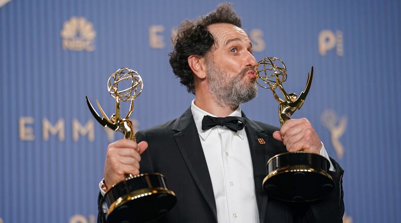 Matthew Rhys poses in the press room with the awards for outstanding lead actor in a limited or anthology series or movie for "The Beast In Me," and outstanding lead actor in a comedy series for "Widow's Bay" during the 78th Emmy Awards on Monday, Sept. 14, 2026, at the JW Marriott in Los Angeles. (Photo by Richard Shotwell/Invision/AP)