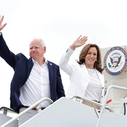 US Vice President and 2024 Democratic presidential candidate Kamala Harris and her running mate Minnesota Governor Tim Walz wave as they board Air Force Two, departing Chippewa Valley Regional Airport in Eau Claire, Wisconsin on Aug. 7, 2024. (Kamil Krzaczynski/AFP via Getty Images/TNS)