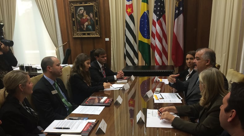 Brazilian and Georgian officials hammer out the final details of an education pact.