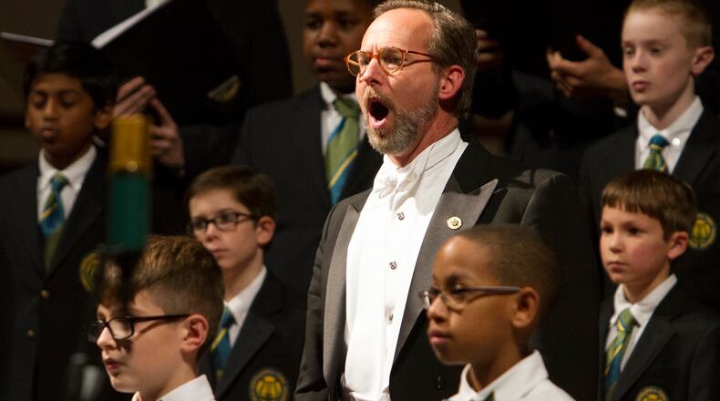 David R. White, artistic director and conductor of the Georgia Boy Choir, works with his singers. The Atlanta-based choir offers musical education for boys from five years old through high school. Photo by Tim Redman