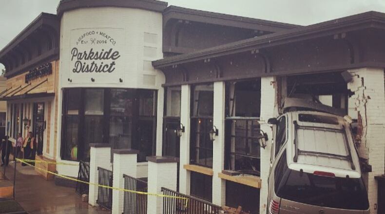 A car crashed through the wall of soon-to-open Parkside District on Sunday.