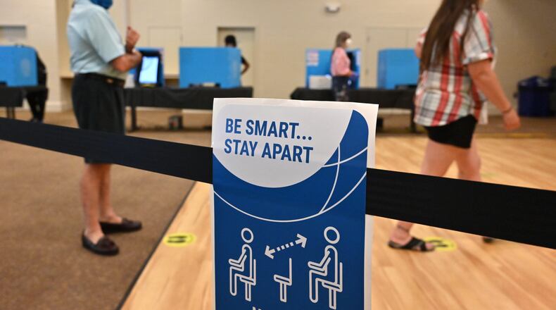 June 9, 2020 Norcross - Gwinnett County residents maintain social distancing cast their votes during the Georgia primary elections at Pinckneyville Community Center in Norcross on Tuesday, June 9, 2020. (Hyosub Shin / Hyosub.Shin@ajc.com)