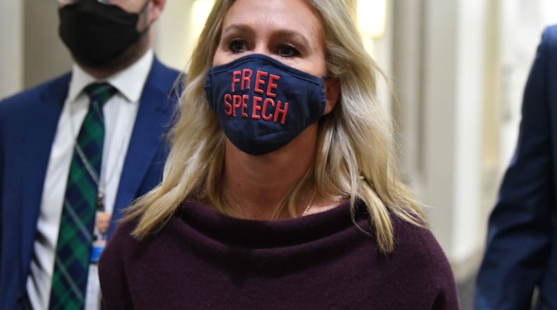 U.S. Rep. Marjorie Taylor Greene, Republican of Georgia, leaves her office on Capitol Hill on Feb. 4. To date, Greene has received notices of fines totaling $60,500 for not abiding by a mask mandate that House Speaker Nancy Pelosi put in place. Greene is challenging the fines in court. (Nicholas Kamm/AFP/Getty Images/TNS)