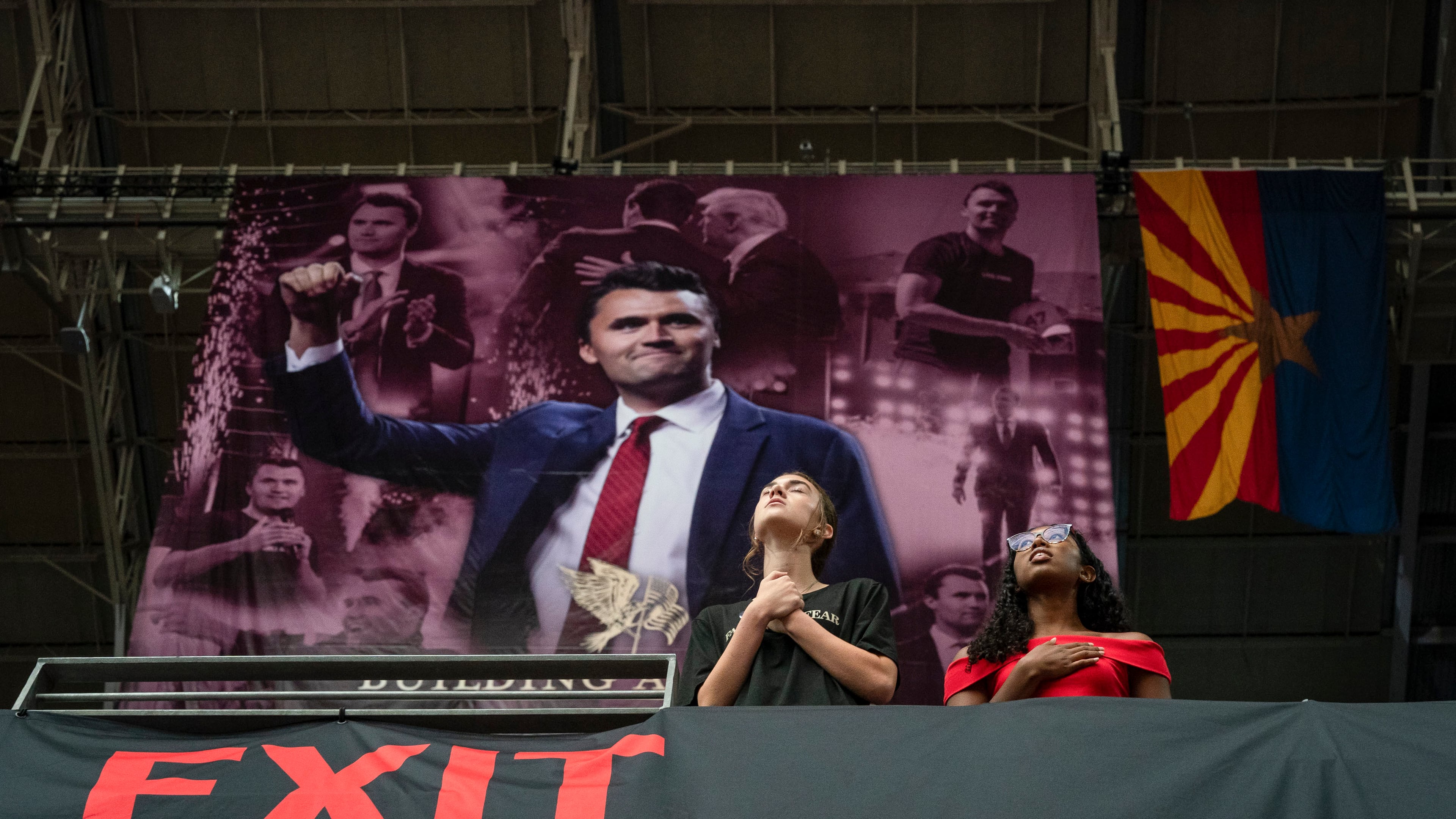 Attendees pray during the memorial service for Charlie Kirk at State Farm Stadium in Glendale, Ariz., on Sunday, Sept. 21, 2025. (Loren Elliott/The New York Times)