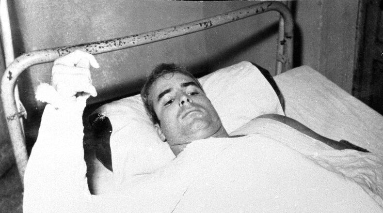 LCdr. John S. McCain, USN, is shown in this undated photo lying injured in North Vietnam wearing an arm cast. He was a held prisoner during the Vietnam War. (AP Photo)