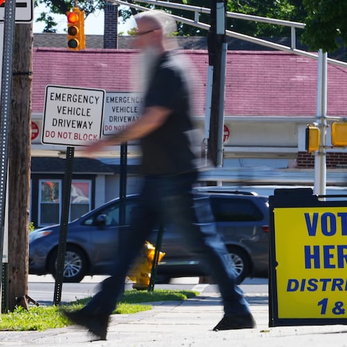 A person walks from a polling place for the New Jersey primary election in Oaklyn, N.J., Tuesday, June 2, 2026. (AP Photo/Matt Rourke)