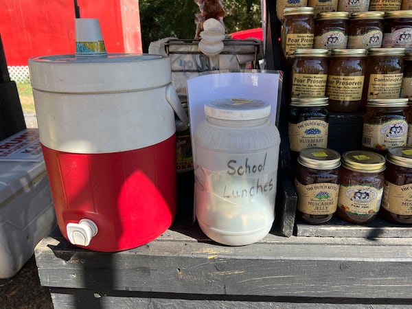 After learning how much money was owed across the county’s elementary schools, Michael Meaders began collecting donations in a jar at his produce stand. (Courtesy of Ella Kroll)