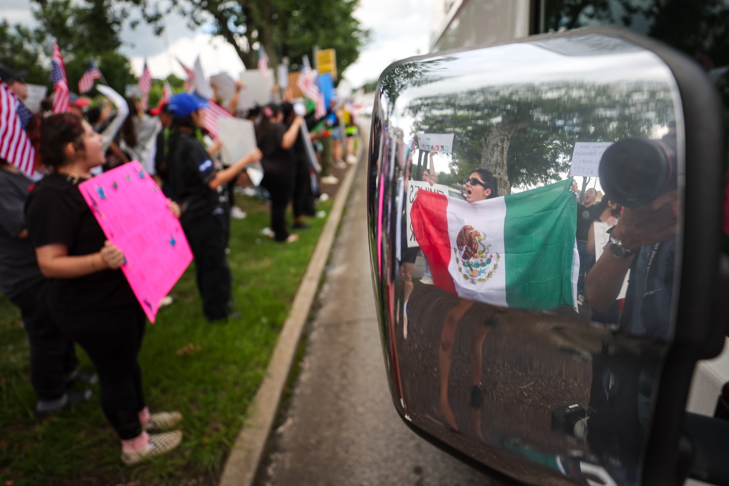 Demonstrators chant during a protest on ICE raids and deportation arrests on Chamblee Tucker Road in Atlanta on Saturday, June 14, 2025. (Arvin Temkar / AJC)