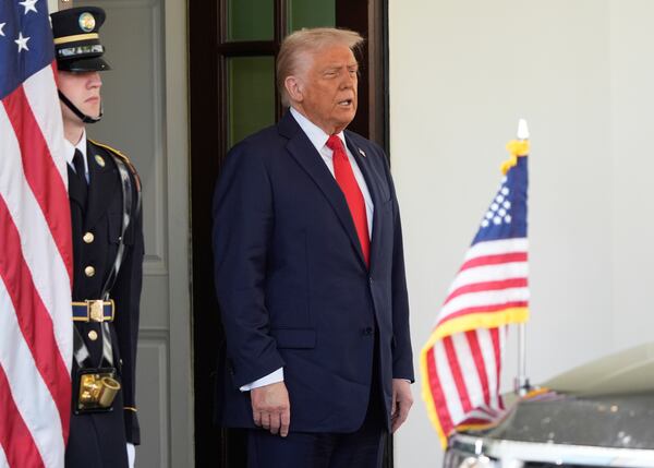 President Donald Trump waits to greet El Salvador's President Nayib Bukele at the White House, Monday, April 14, 2025, in Washington. (AP Photo/Manuel Balce Ceneta)