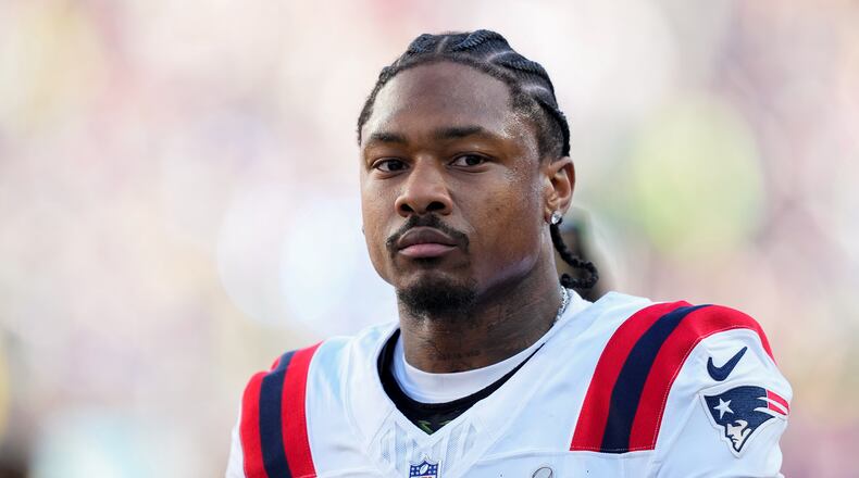 FILE - New England Patriots wide receiver Stefon Diggs walks off the field before the NFL Super Bowl 60 football game against the Seattle Seahawks, Feb. 8, 2026, in Santa Clara, Calif. (AP Photo/Julio Cortez, File)