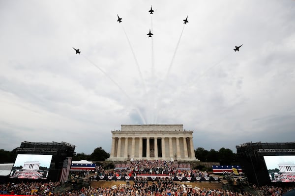 FILE - President Donald Trump, first lady Melania Trump, Vice President Mike Pence and Karen Pence and others stand as the US Army Band performs and the US Navy Blue Angels flyover at the end of an Independence Day celebration in front of the Lincoln Memorial, July 4, 2019, in Washington. (AP Photo/Alex Brandon, File)