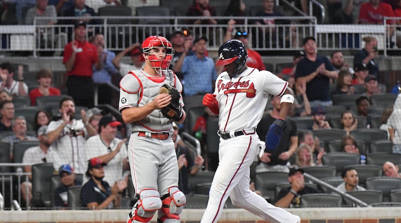 September 29, 2021 Atlanta - Atlanta Braves right fielder Jorge Soler (12) scores on an RBI single by Atlanta Braves third baseman Austin Riley (27) in the first inning at Truist Park on Wednesday, September 29, 2021. (Hyosub Shin / Hyosub.Shin@ajc.com)
