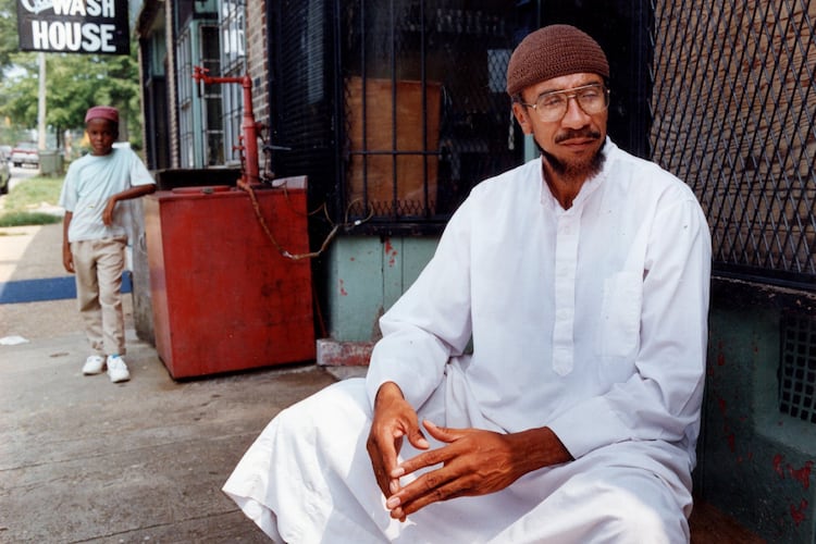 Imam Jamil Abdullah Al-Amin, the former H. Rap Brown, in front of his West End Community grocery store on Oak Street in 1990. (Kathryn Kolb/AJC file)