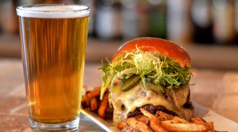Grab a burger and beer for $14 tonight at Vine & Tap. Photo credit: Henri Hollins.