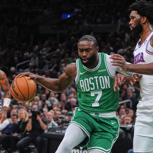 FILE - Boston Celtics forward Jaylen Brown (7) drives to the basket against Philadelphia 76ers center Joel Embiid, right, during the first half of an NBA basketball game, Wednesday, Oct. 22, 2025, in Boston. (AP Photo/Charles Krupa,File)
