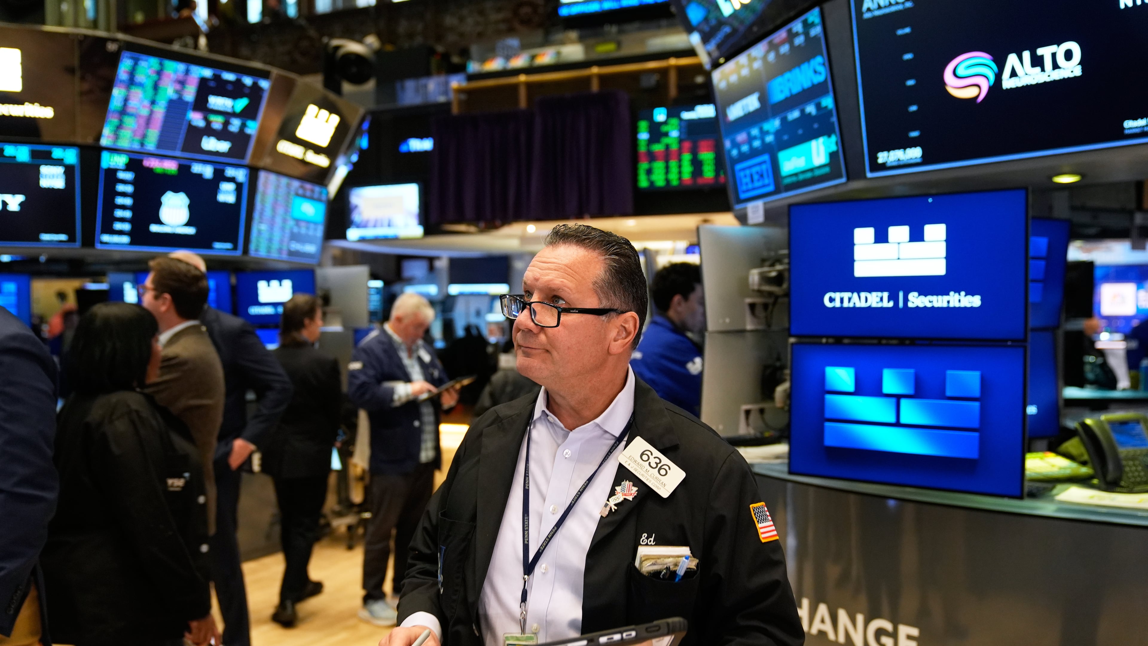 Edward Curran works on the floor at the New York Stock Exchange in New York, Tuesday, Nov. 11, 2025. (AP Photo/Seth Wenig)