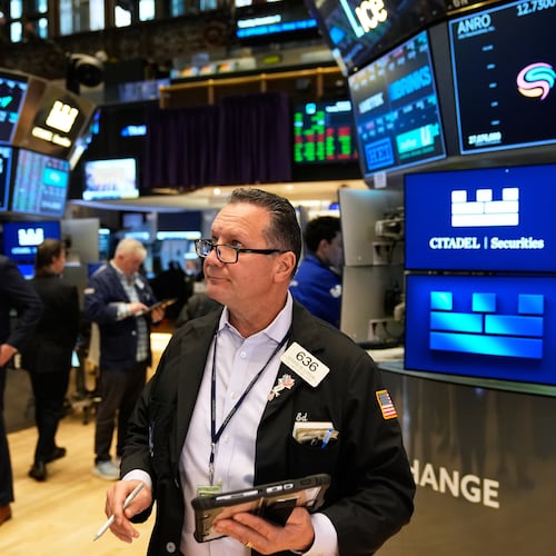Edward Curran works on the floor at the New York Stock Exchange in New York, Tuesday, Nov. 11, 2025. (AP Photo/Seth Wenig)