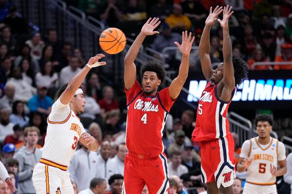 Iowa State guard Tamin Lipsey (3) passes the ball against Mississippi forward Jaemyn Brakefield (4) and Mississippi guard Jaylen Murray (5) during the first half in the second round of the NCAA college basketball tournament, Sunday, March 23, 2025, in Milwaukee. (AP Photo/Kayla Wolf)