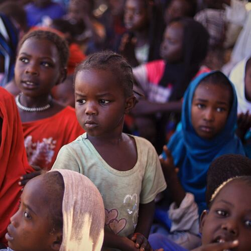 This photo released by The Norwegian Refugee Council (NRC), shows displaced children from el-Fasher at a camp where they sought refuge from fighting between government forces and the RSF, in Tawila, Darfur region, Sudan, Monday, Nov. 3, 2025. (NRC via AP)