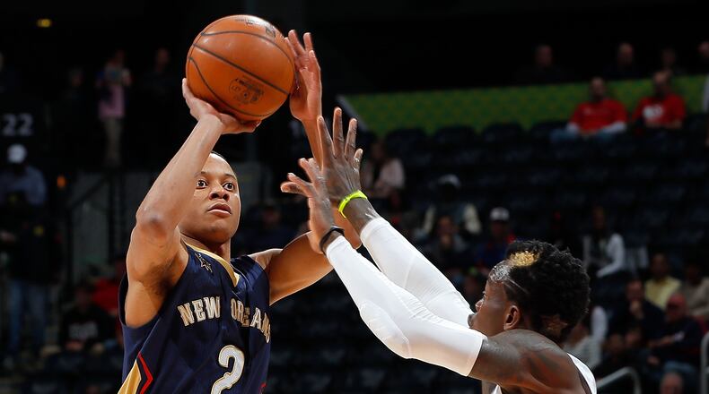 ATLANTA, GA - NOVEMBER 22: Tim Frazier #2 of the New Orleans Pelicans shoots against Dennis Schroder #17 of the Atlanta Hawks at Philips Arena on November 22, 2016 in Atlanta, Georgia. (Photo by Kevin C. Cox/Getty Images)
