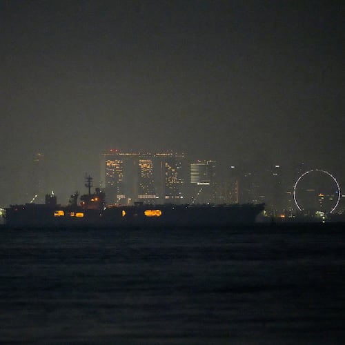 The U.S. Navy aircraft carrier USS Abraham Lincoln sails past Singapore as seen from Batam, Indonesia, Sunday, Aug. 30, 2026. (AP Photo/Dita Alangkara)
