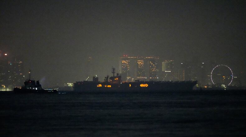 The U.S. Navy aircraft carrier USS Abraham Lincoln sails past Singapore as seen from Batam, Indonesia, Sunday, Aug. 30, 2026. (AP Photo/Dita Alangkara)
