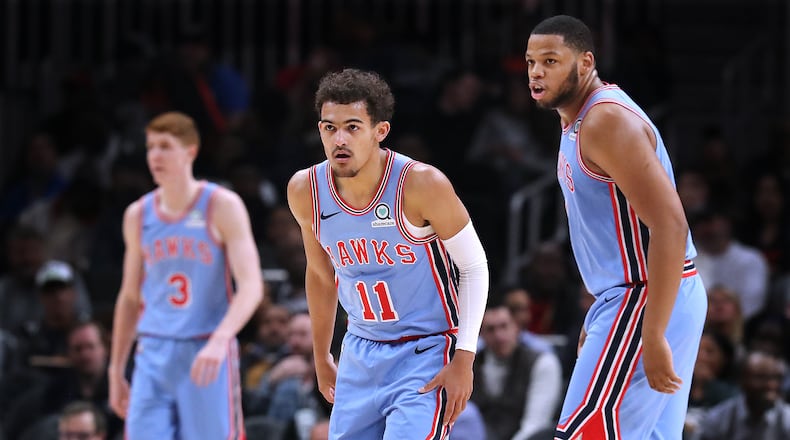 Jan. 15, 2019 Atlanta: Atlanta Hawks Kevin Huerter (from left), Trae Young, and Omari Spellman work on defense against the Oklahoma City Thunder during the first half in a NBA basketball game on Tuesday, Jan. 15, 2019, at State Farm Arena in Atlanta. Curtis Compton/ccompton@ajc.com