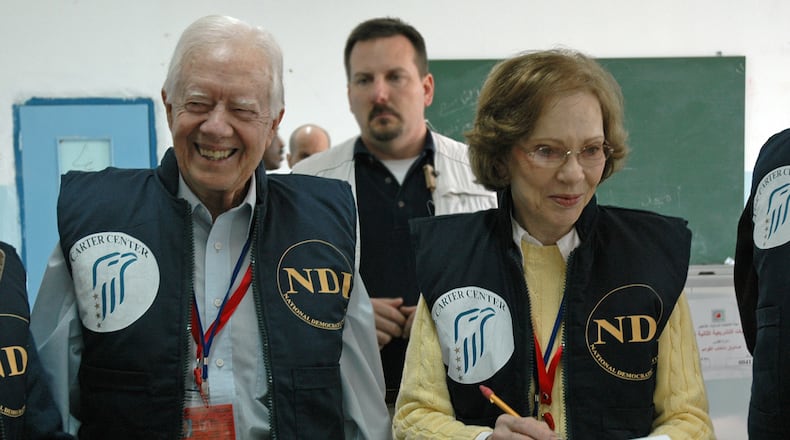 Former President Jimmy Carter (left) and his wife, Rosalynn, observe the 2006 Palestinian parliamentary elections as part of an 80-member delegation, organized by the Carter Center and the National Democratic Institute. (Courtesy of the Carter Center)