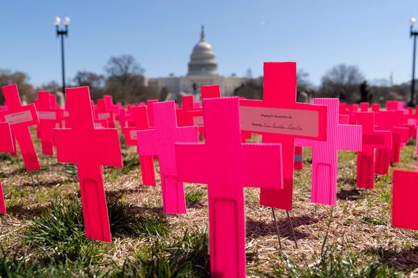 With the U.S.Capitol in the background, crosses are placed on the ground during an anti-abortion rally on Capitol Hill in Washington, Thursday, March 27, 2025. (AP Photo/Jose Luis Magana)