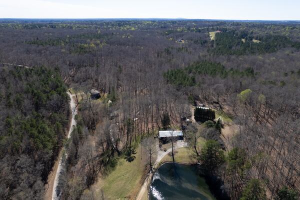 Drone photo was taken in Gwinnett County, Georgia, looking south with 463 Old Freeman Mill Road in the center (with lake) and 503 Old Freeman Mill Road behind it and to the left.  Ben Gray for The Atlanta Journal-Constitution