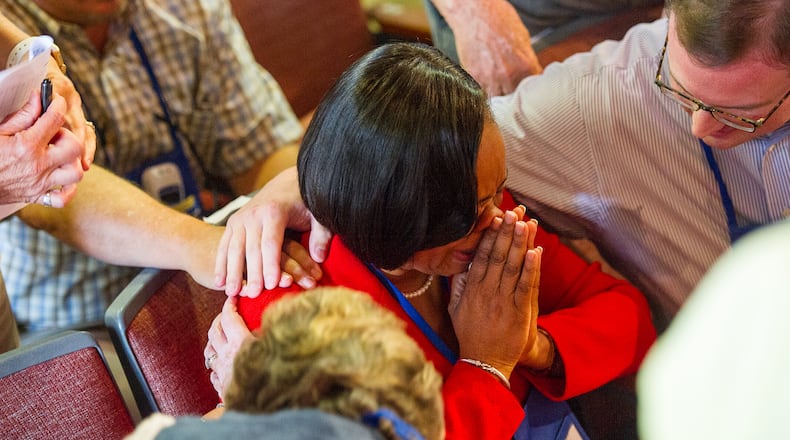 Delegates of the United Methodist Church leaped from their chairs in a sustained eruption of cheers and tears Wednesday afternoon with the first-ballot election of Rev. Sharma Lewis as bishop.