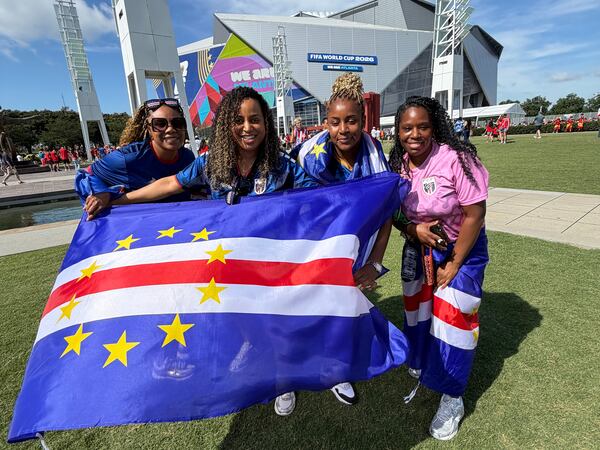 Georgia Monteiro (far right) and friends show their support for Cape Verde outside Atlanta Stadium on Mon., June 15. (Gavin Godfrey/AJC)