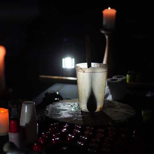 FILE - An empty pitcher and shot sized cups sit on an altar during an ayahuasca ceremony at a retreat in Hildale, Utah, Oct. 14, 2022. (AP Photo/Jessie Wardarski, File)